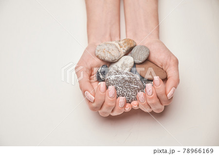 Woman hands with beautiful manicure on light background 78966169