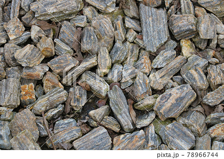 The texture of broken stones on the ground, background. The texture of broken stones on the ground, background. 78966744
