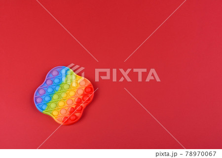 Bright colorful children's toy made of silicone designed to relieve stress Bright colorful children's toy made of silicone designed to relieve stress 78970067