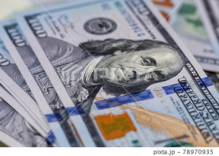 Close up of one hundred US dollar banknotes. Money background. Financial, business, investment and economical concept. Close up of one hundred US dollar banknotes. Money background. Financial, business, investment and economical concept. 78970935