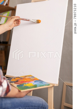 Male artist working on painting. Man artist painter in creative studio Male artist working on painting. Man artist painter in creative studio 78973210