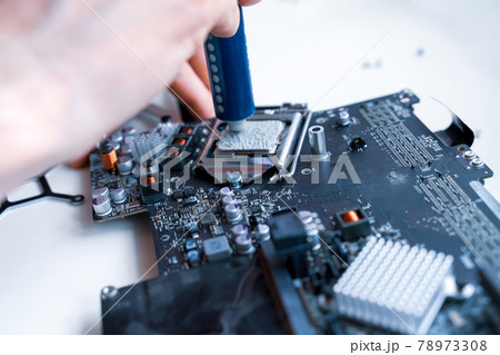 Computer chip electronic repair. Hardware engineer technology maintenance. Man technician pc service. Computer chip electronic repair. Hardware engineer technology maintenance. Man technician pc service. 78973308