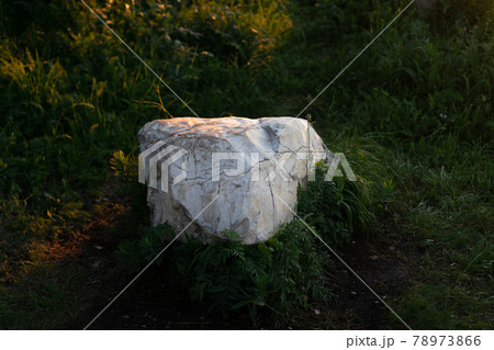 Tourism vacation and travel. Stone stack in foreground and snowcapped mountain tops hills Tourism vacation and travel. Stone stack in foreground and snowcapped mountain tops hills 78973866