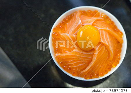 Salmon ikura donburi with salmon roe and egg yolk Salmon ikura donburi with salmon roe and egg yolk 78974573