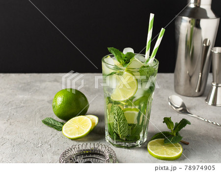 Refreshing summer mojito cocktail with ice cubes, fresh mint and lime. 78974905