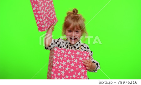 Cheerful stylish child girl opening gift box, great happiness amazement, satisfied with best present 78976216