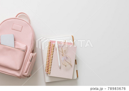 Student female backpack full of schooler supplies isolated with copy space. Back to school concept Student female backpack full of schooler supplies isolated with copy space. Back to school concept 78983676