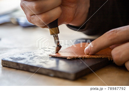 Craftsman machines edge of natural stuff workpiece use professional curly knife. Leather workshop 78987792