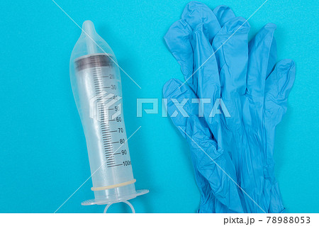 Anti Vaccination Concept - Syringe in a Condom Anti Vaccination Concept - Syringe in a Condom 78988053