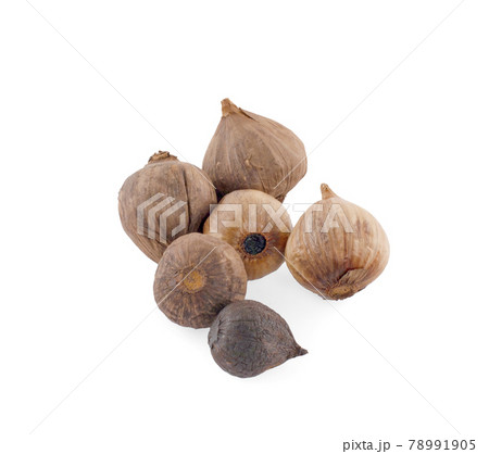 Black garlic bulbs and cloves isolated on white background Black garlic bulbs and cloves isolated on white background 78991905
