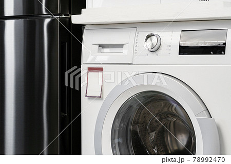 New washing machine in a home appliances store 78992470