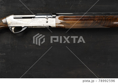 Smoothbore hunting gun on black background close up 78992596