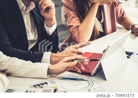 Businessman and businesswomen working in office. 78993573