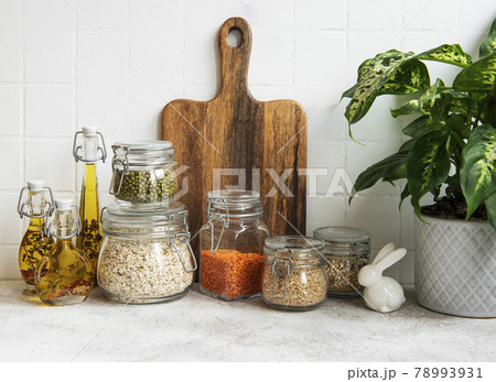 Kitchen utensils, tools and dishware on on the background white tile wall. Kitchen utensils, tools and dishware on on the background white tile wall. 78993931