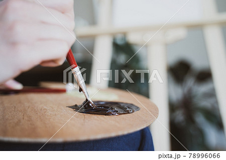 The artist mixes paint with a brush, close-up. Color palette. Learning to draw The artist mixes paint with a brush, close-up. Color palette. Learning to draw 78996066