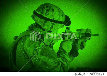 Us military firing m4 assault rifle. View through night vision. Noise and film grain is special photo effect of night vision camera. 78998171