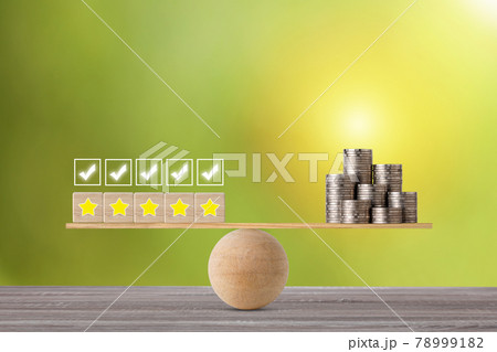 Excellent business five star rating experience on wooden block with money stacking coin on seesaw balancing, meaning business gain money after customer satisfaction Excellent business five star rating experience on wooden block with money stacking coin on seesaw balancing, meaning business gain money after customer satisfaction 78999182
