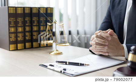 Lawyers or judges sign documents in accordance with legal and fair terms of agreement, Legal Ethics and Integrity, scales of justice, law hammer, Litigation and legal services. Lawyers or judges sign documents in accordance with legal and fair terms of agreement, Legal Ethics and Integrity, scales of justice, law hammer, Litigation and legal services. 79002077