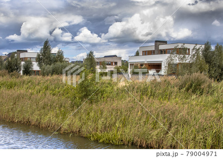 Neighborhood with ecological houses in natural setting Neighborhood with ecological houses in natural setting 79004971