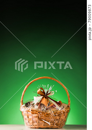 gift basket on green background gift basket on green background 79009873