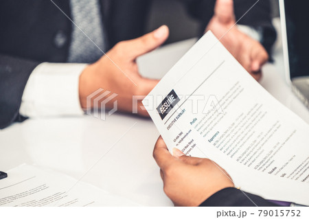 Human resources department manager reads CV resume Human resources department manager reads CV resume 79015752