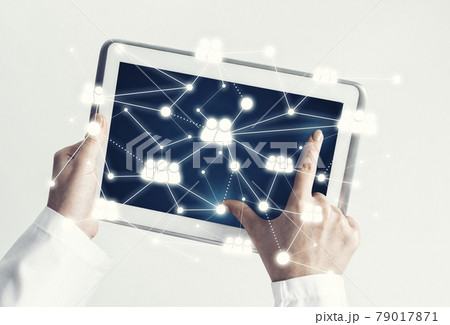 Close of female doctor hands working with tablet pc computer Close of female doctor hands working with tablet pc computer 79017871
