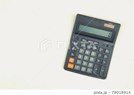 Black big calculator on white background. Toned Black big calculator on white background. Toned 79018914