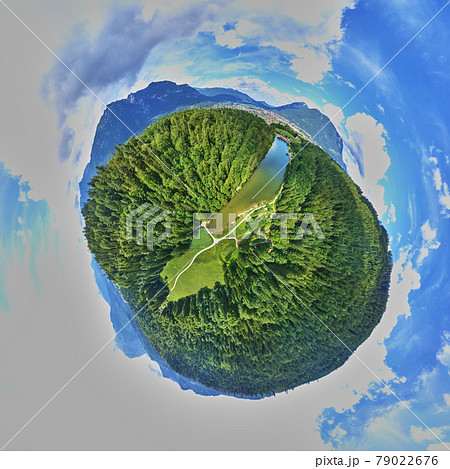 Long stretched narrow lake in Bavaria between woods and meadows in front of a city, Little Planet, Spherical 360 degrees seamless panorama view in Spherical projection Long stretched narrow lake in Bavaria between woods and meadows in front of a city, Little Planet, Spherical 360 degrees seamless panorama view in Spherical projection 79022676