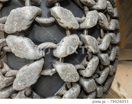 Machinerydetail, chain wheel of heavy bulldozer or excavator in open gravel quarry. Machinerydetail, chain wheel of heavy bulldozer or excavator in open gravel quarry. 79026055