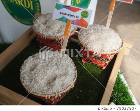 SERDANG, MALAYSIA -DECEMBER 03, 2016: Rice in colorful bamboo bowl on rack at Serdang, Selangor. It is display on rack for public and categorized by type.  79027807