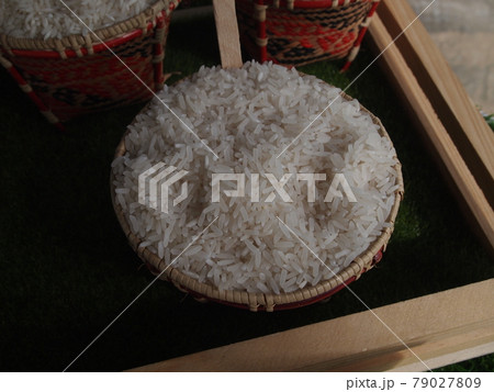 SERDANG, MALAYSIA -DECEMBER 03, 2016: Rice in colorful bamboo bowl on rack at Serdang, Selangor. It is display on rack for public and categorized by type.  79027809