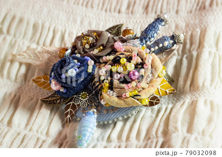 Textile brooch with embroidered flowers Textile brooch with embroidered flowers 79032098