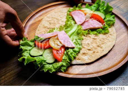 pita with vegetables and sausage.simple and delicious snack of flatbread 79032785