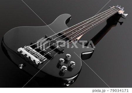Bass guitar isolated on a black background Bass guitar isolated on a black background 79034171