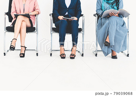 Business people job applicants waiting on chairs. Business people job applicants waiting on chairs. 79039068