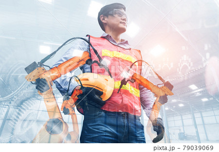 Mechanized industry robot arm and factory worker double exposure 79039069