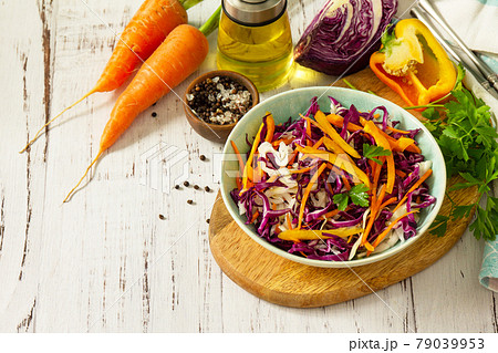 Cole Slaw. Cabbage salad in a bowl on a wooden table. Copy space. Cole Slaw. Cabbage salad in a bowl on a wooden table. Copy space. 79039953
