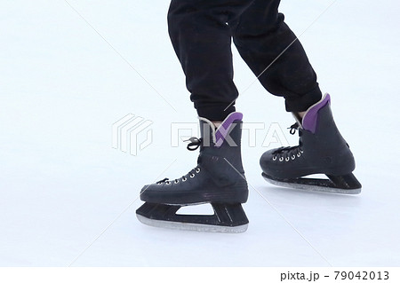 Feet skating on the ice rink Feet skating on the ice rink 79042013