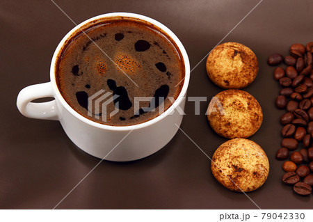white cup of hot black coffee with biscuits and beans white cup of hot black coffee with biscuits and beans 79042330