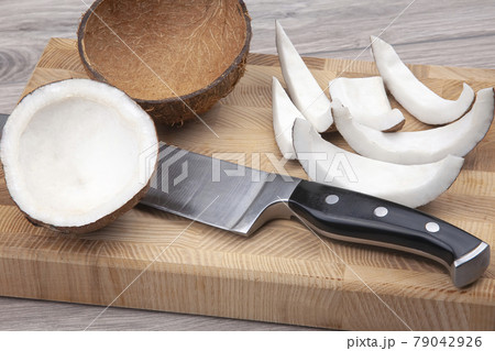 peeled coconut on a wooden board. vitamin fruits. healthy food peeled coconut on a wooden board. vitamin fruits. healthy food 79042926