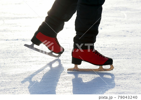 Feet skating on the ice rink Feet skating on the ice rink 79043240
