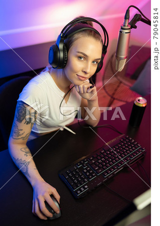 E-sport gamer girl live streaming and plays online video game on PC E-sport gamer girl live streaming and plays online video game on PC 79045814