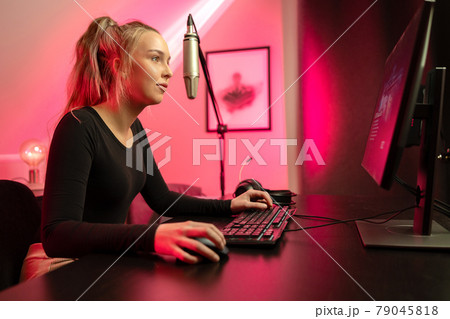 Esport gamer girl streaming vlog and plays online video game on PC 79045818