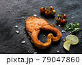 Salmon fillet on an old wooden table 79047860
