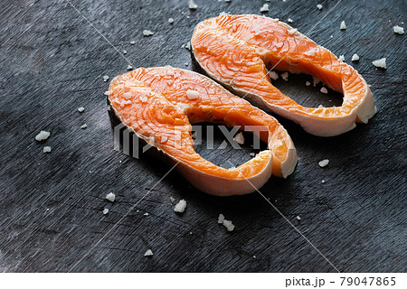 Fresh salmon fish fillet on wooden board 79047865