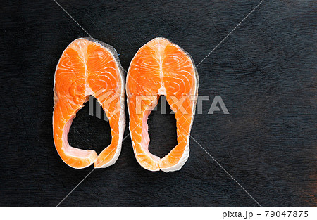 Fresh salmon fish fillet on wooden board 79047875