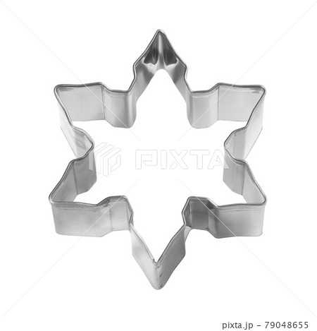 Baking dish for Christmas cookies in the shape of snowflake isolated on white 79048655