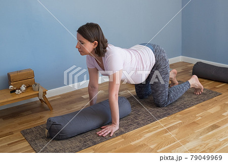 Prenatal yoga meditation. Pregnant woman doing yoga meditation at home Prenatal yoga meditation. Pregnant woman doing yoga meditation at home 79049969