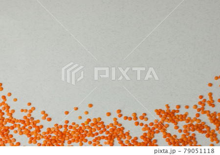 Top view on lentil seeds isolated on a white background.Lentils are rich in vegetable protein and are eaten since prehistoric times.Flat lay with copy space Top view on lentil seeds isolated on a white background.Lentils are rich in vegetable protein and are eaten since prehistoric times.Flat lay with copy space 79051118