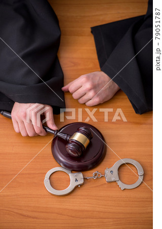 Young male judge working in the courtroom Young male judge working in the courtroom 79051787